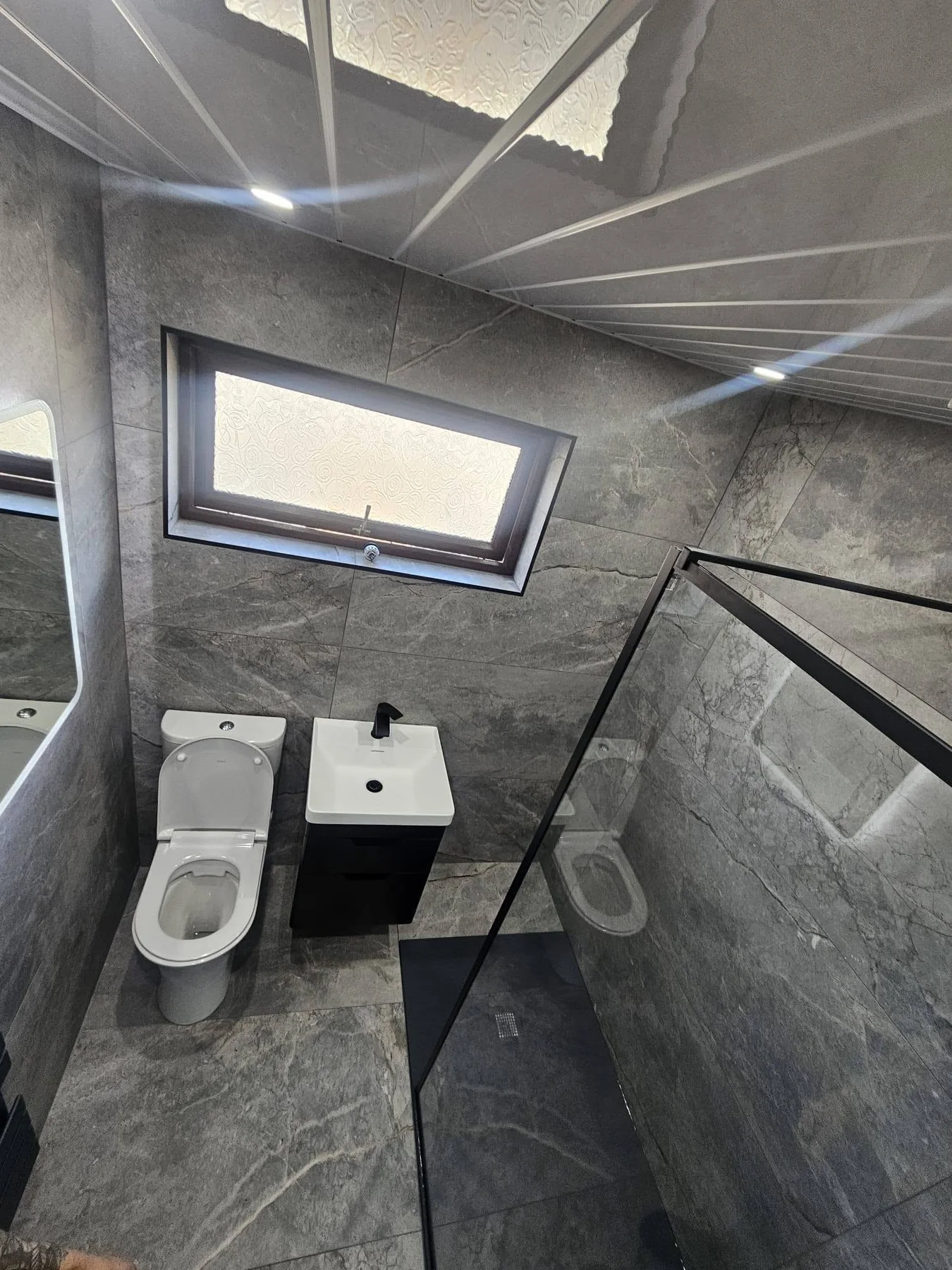 Completed bathroom photograph 4 of Monochrome Stone-Effect Shower Room